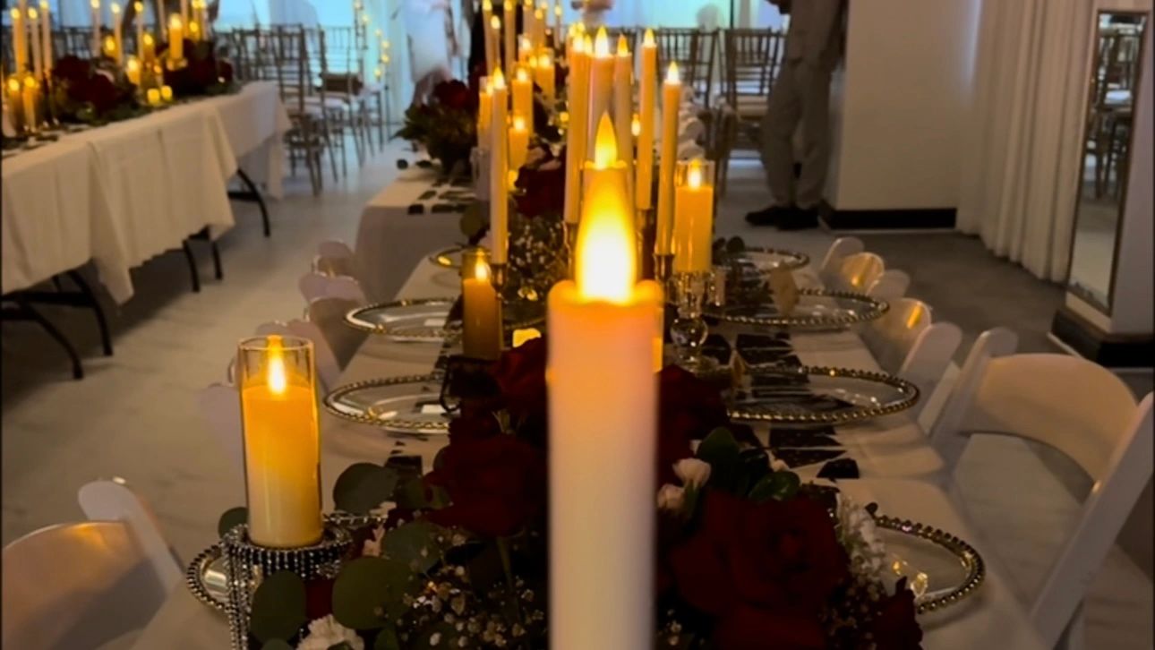 A long table set with candles and place settings