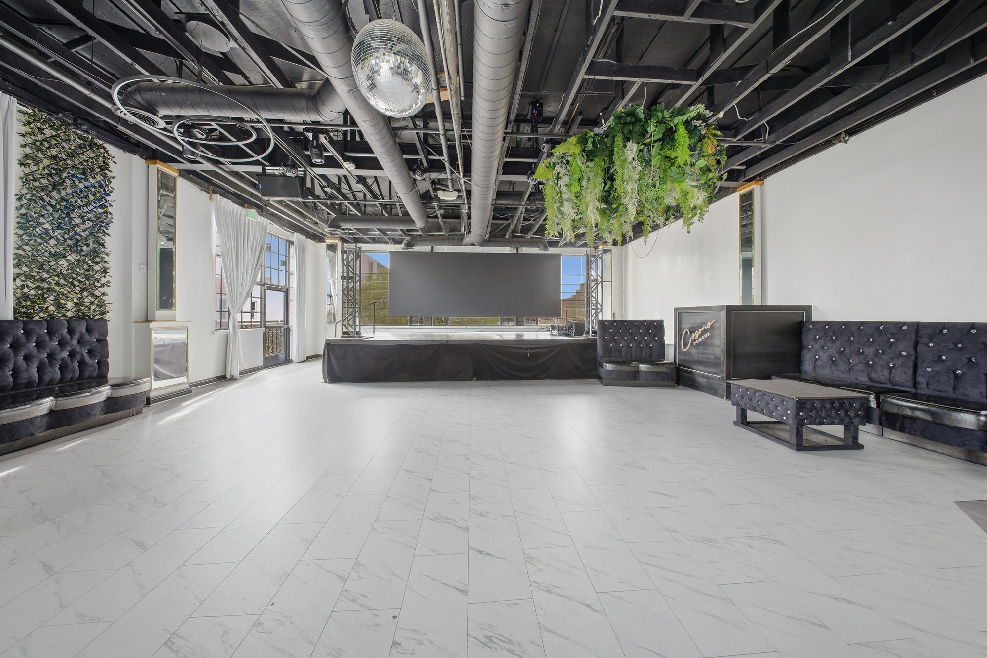 The Ultralounge, greenery hanging over an open marble floor
